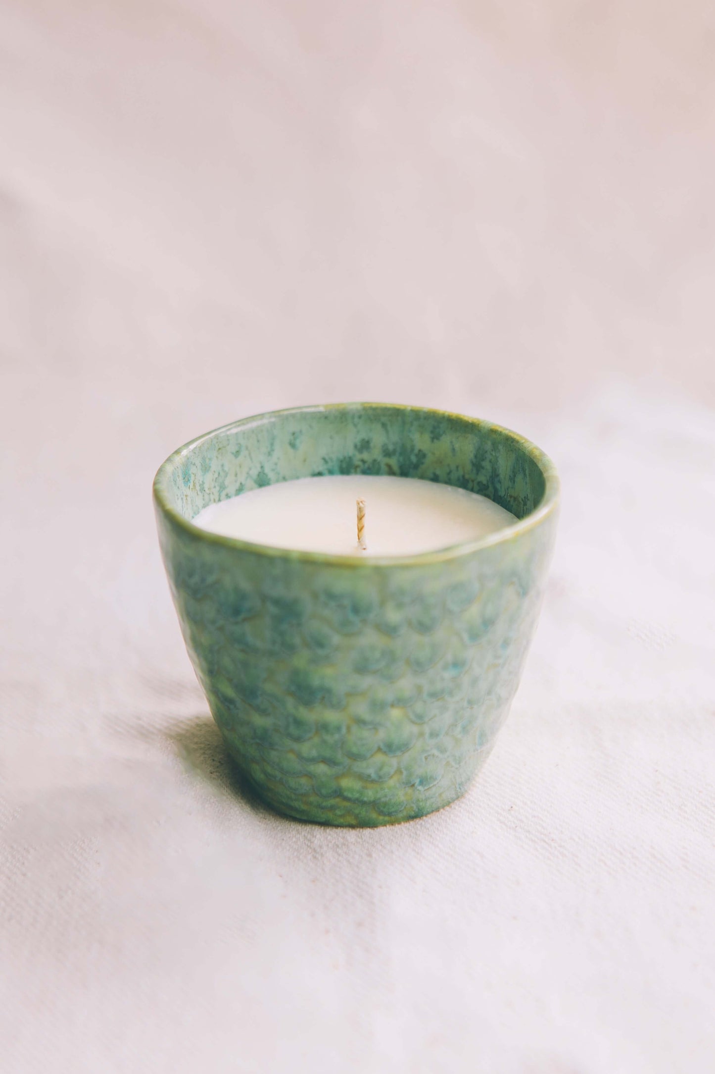 Candle in a reusable ceramic cup