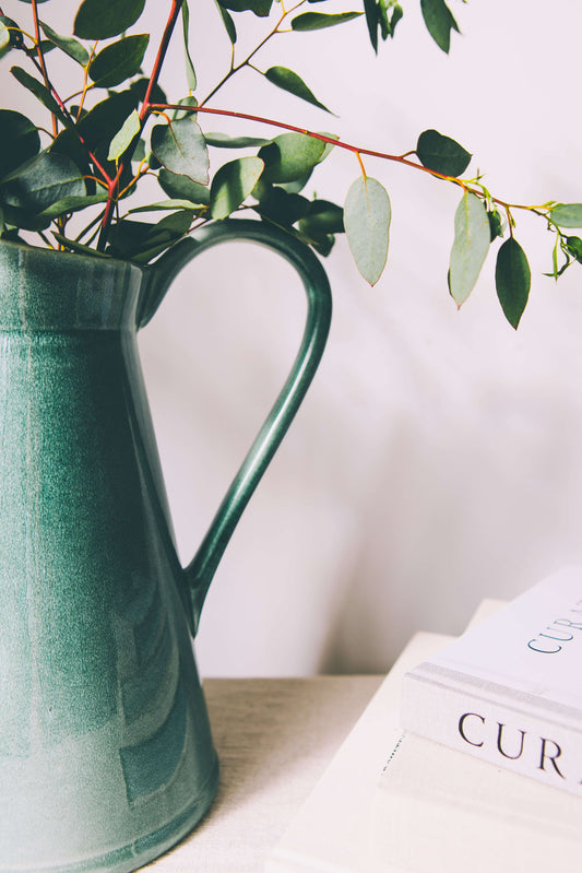 Green glazed ceramic jug