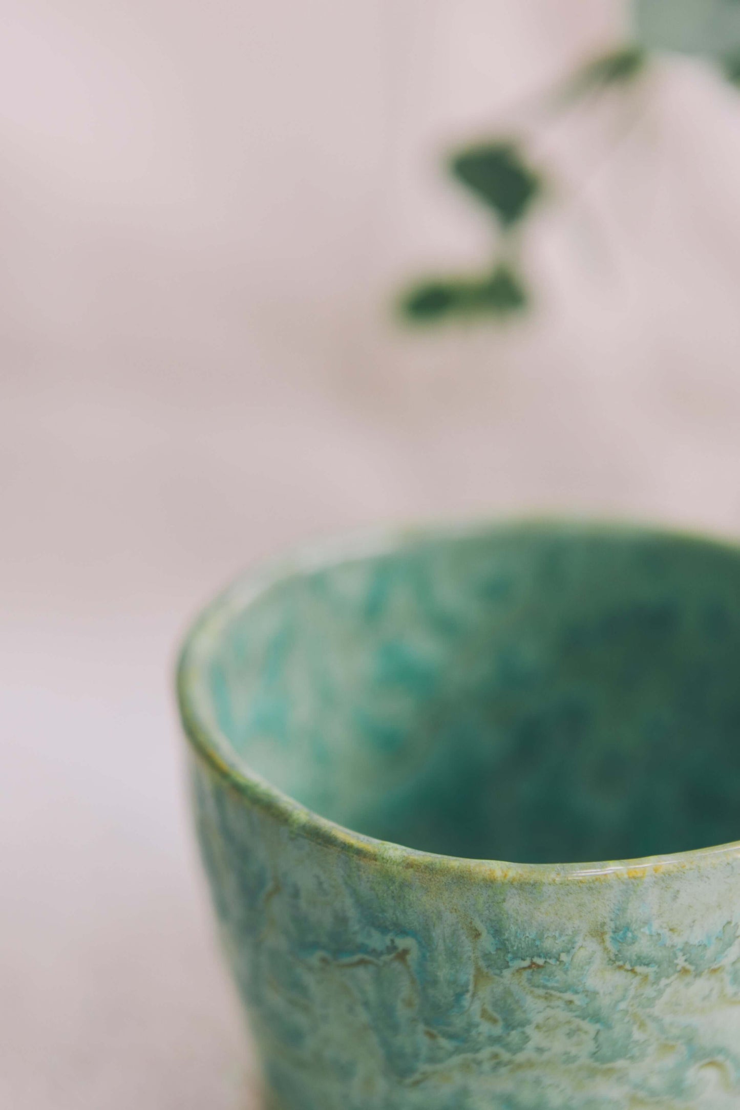 Green glazed ceramic candle cup