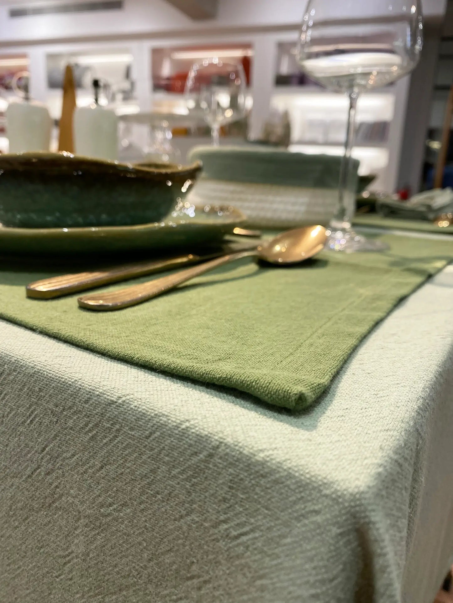 Green linen placemat and tablecloth